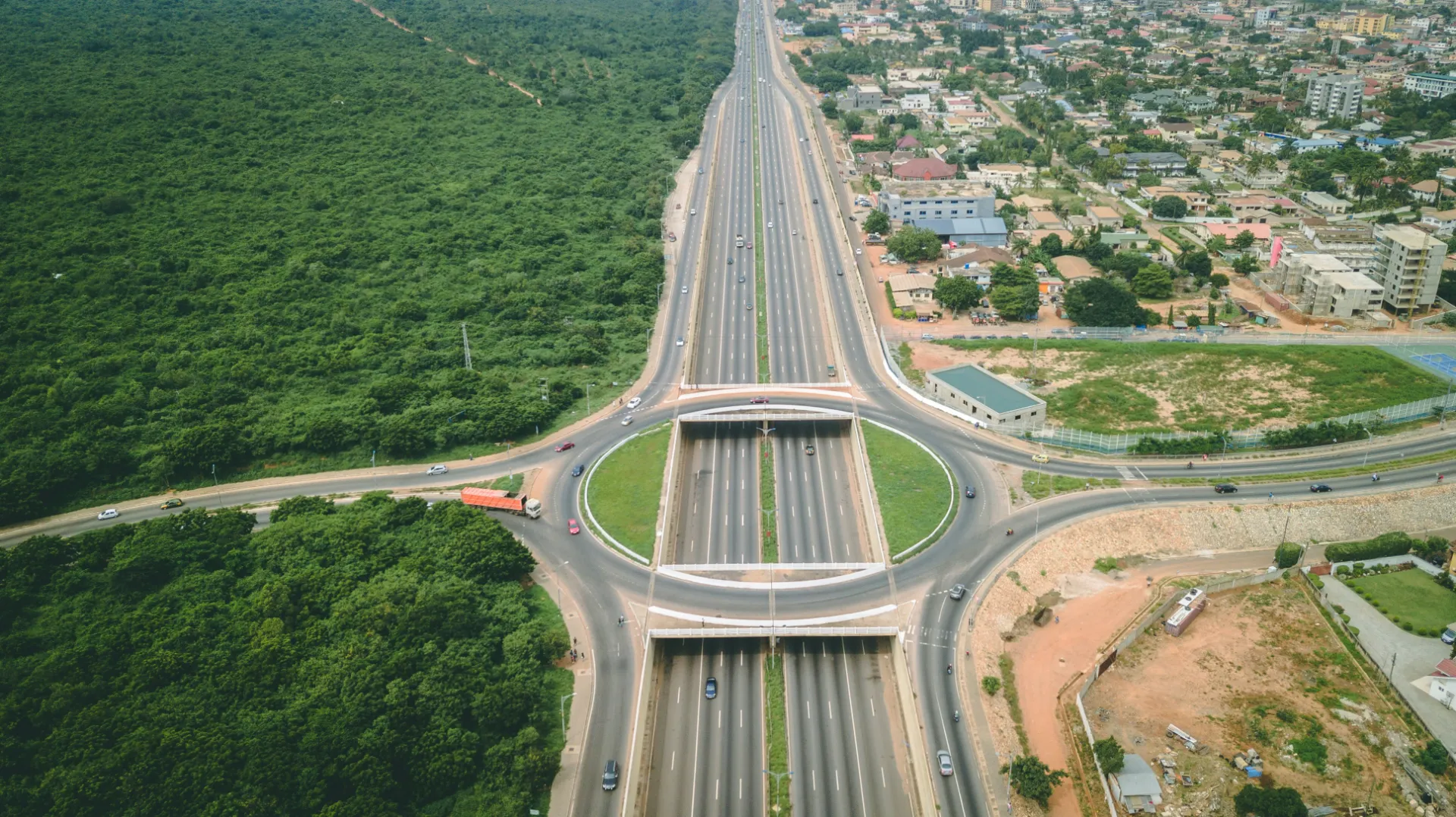 an aerial view of a highway intersection in the middle of a city, Ghana
